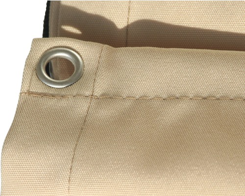 Detalj av ett beige tyg med öljetter