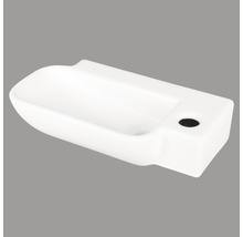 Vit keramisk tvättställ med kranhål