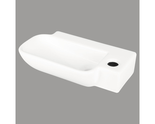 Vit keramisk tvättställ med kranhål