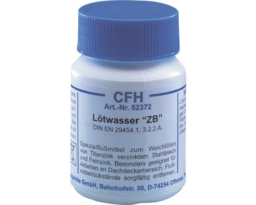 Lötvatten i en plastflaska med blått lock