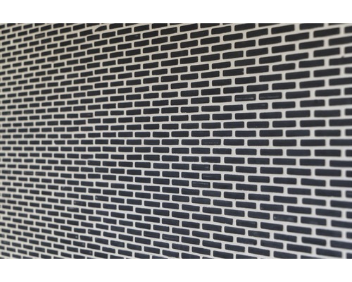 Närbild av en fasad med murverk