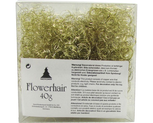 Guldfärgad dekoration av koppartråd i transparent förpackning