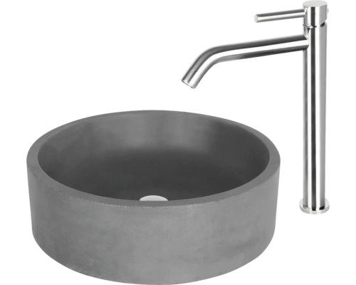 Grått tvättställ i betong med blandare