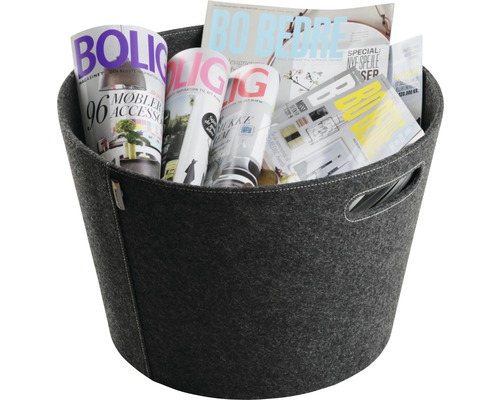 Grå filt korg fylld med tidskrifter