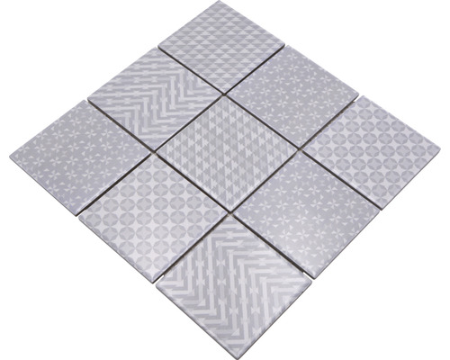 Mönster av fyrkantiga plattor med olika geometriska motiv