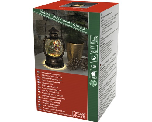 Förpackning av en LED-dekorationslampa med snöglobmotiv