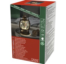 Förpackning med LED-dekorationslampa för inomhusbruk i form av en lykta med snöglobsfunktion