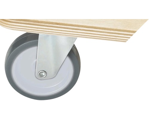 Detaljvy av ett svänghjul med hölje på en möbel.