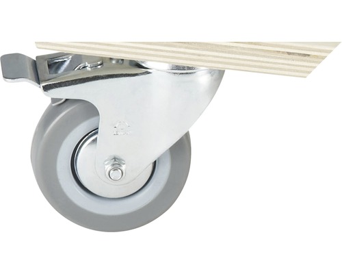 Svängbart hjul med broms på en träplatta