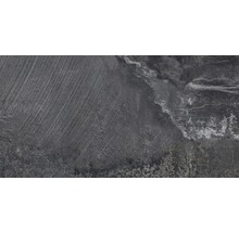 Närbild av en grå keramisk platta med strukturerad yta