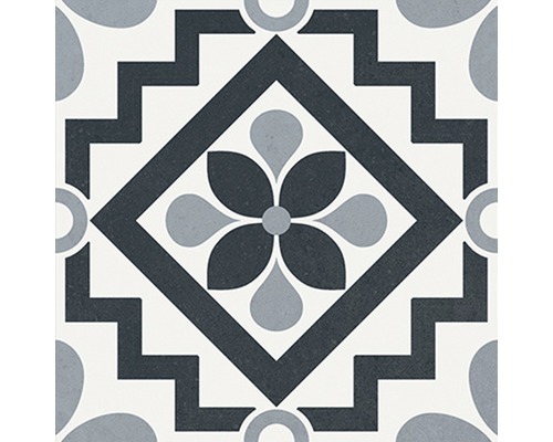 Dekorativ golvplatta med blommönster och geometriska element