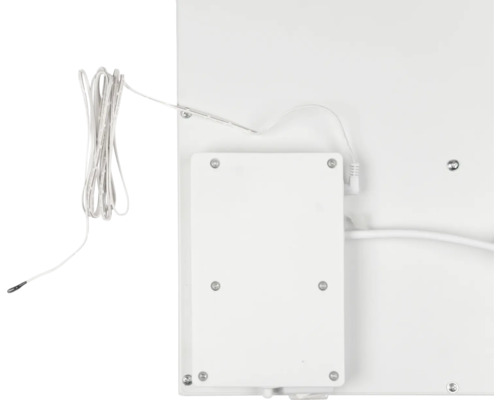 Baksida av ett vitt element med termostat och kabel