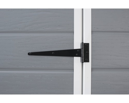 T-gångjärn fäst på en trädörr