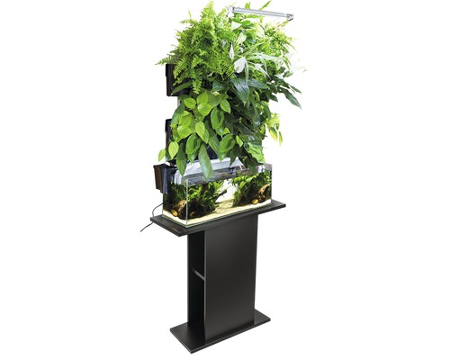 Vertikal inomhusträdgård med akvarium och växtbelysning på en svart piedestal