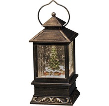 Dekorativ lykta med vinterlandskap och julgran