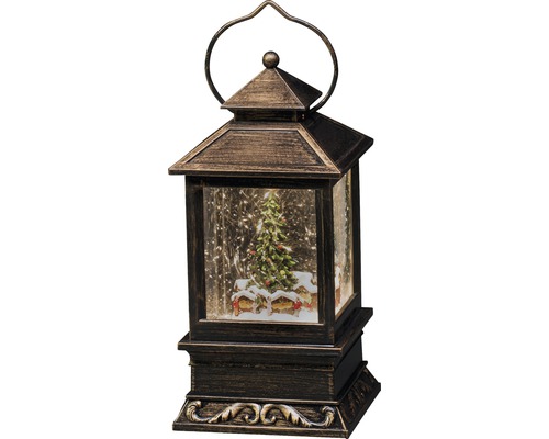 Dekorativ lykta med vinterlandskap och julgran