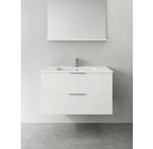 Vitt tvättställsskåp med två lådor, blandare och spegel för badrummet.