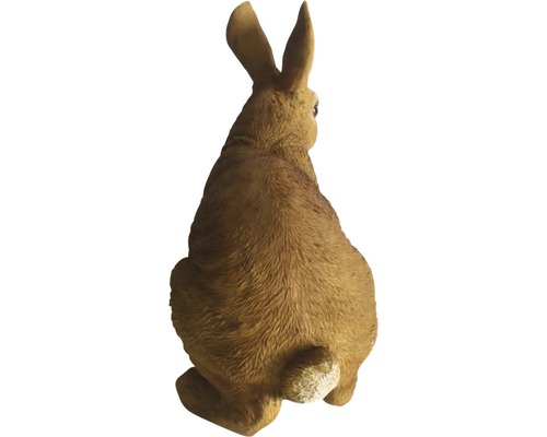 Bakifrån av en kaninfigur för trädgården