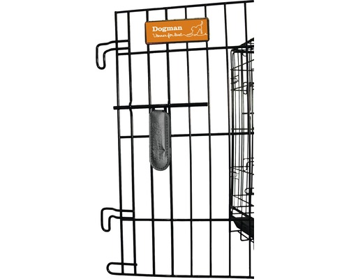 Detaljvy av en svart hundbur med Dogman-logotyp