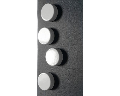 Fyra runda magneter på en yta