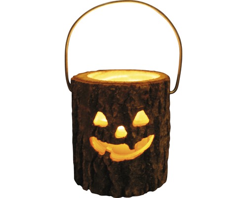 Halloweenlykta i form av en trädstam med handtag och snidat ansikte