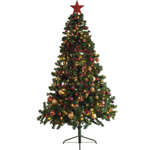 Dekorerad julgran med stjärna och belysning