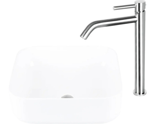 Tvättställsskål av keramik med tvättställsblandare av metall