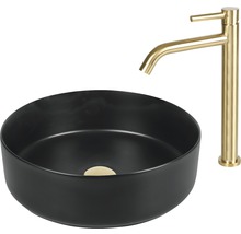 Svart tvättställsskål med guldfärgad armatur