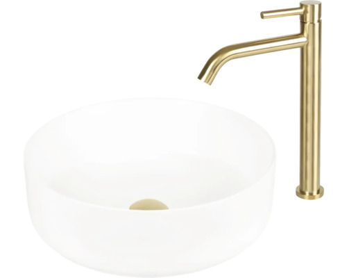 Tvättställ i keramik med guldfärgad blandare