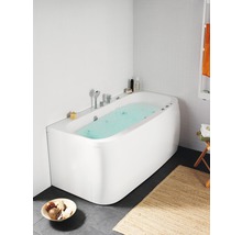 Modernt badrum med fristående badkar, armaturer och badrumstillbehör.