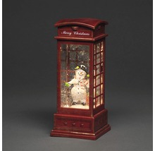 Snöglob i telefonkiosk med snögubbe figur