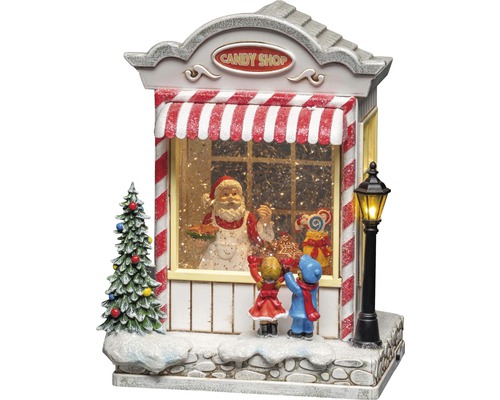 Dekorativ snöglob med godisaffär, jultomte och barn som juldekoration