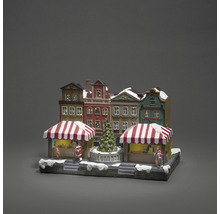 Julmarknadsby med hus, stånd och julgran som dekoration