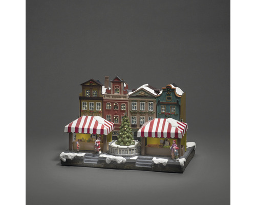 Julmarknadsby med hus, stånd och julgran som dekoration