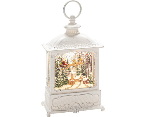 Dekorativ lykta med julmotiv inuti
