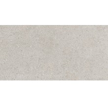 Ljust golvkakel med spräcklig yta