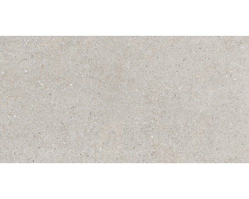 Ljust golvkakel med spräcklig yta