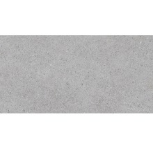 Grått golvkakel med spräcklig textur