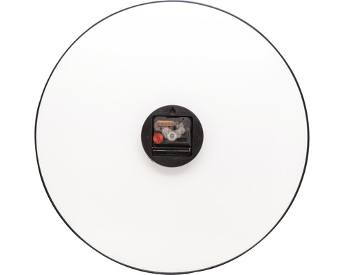 Baksidan av en rund väggklocka med urverk