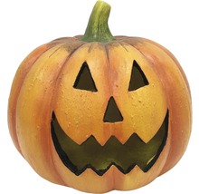 Halloweenpumpa med snidat ansikte som dekoration