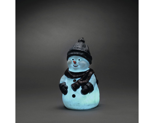 Dekorativ snögubbe med mössa och halsduk som ljusfigur