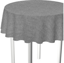 Grå rund bordsduk på ett bord