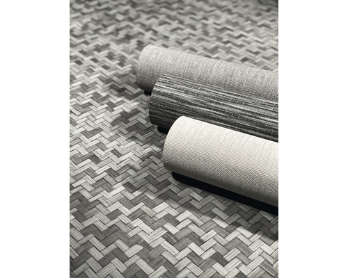 Tre rullar matta på en vävd bakgrund