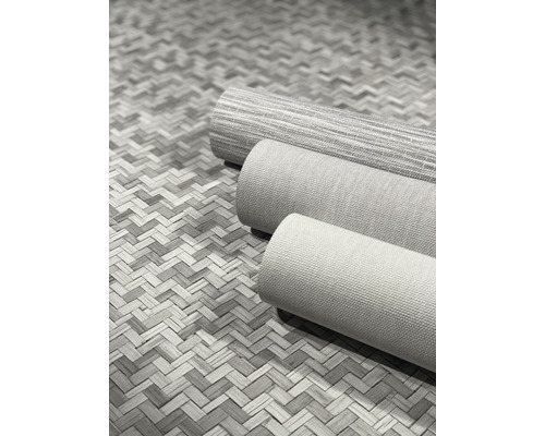 Tre rullar textil tapet på en flätad bakgrund