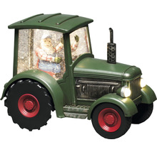 Dekorativ grön traktor med jultomtefigur och snö