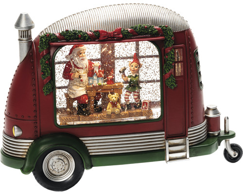 Snöglob i form av husvagn med jultomten och en tomte