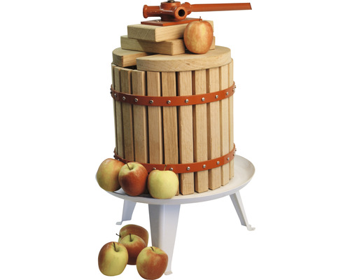 Äppelpress i trä med äpplen på ett bord