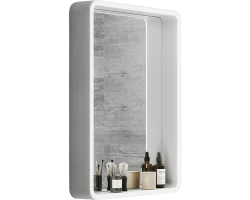 Vitt spegelskåp med toalettartiklar