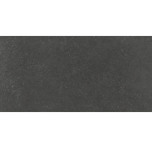 Mörkt golvkakel med spräcklig yta