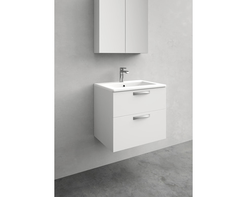 Vitt tvättställ med två lådor och underskåp i badrummet.